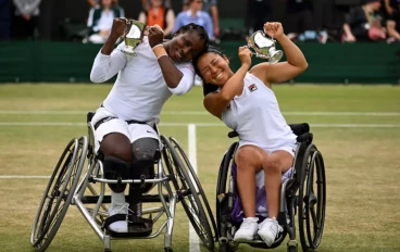 Yui Kamiji of Japan and Kgothatso Montjane of South Africa pose with the Ladies' Wheelchair Doubles Trophy following victory against Diede de Groot of the Netherlands and Jiske Griffioen of t