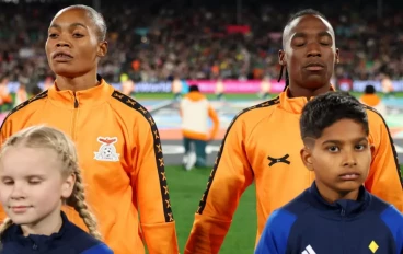 Catherine Musonda and Barbra Banda of Zambia line up for the national anthem prior to the FIFA Women's World Cup Australia & New Zealand 2023 Group C match between Zambia and Japan at Waikato