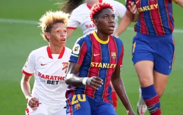 Zenatha Coleman of Sevilla challenges Barcelona's Asisat Oshoala